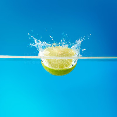 Lime half dropped into water
