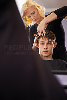 Making sure his hair looks sharp!