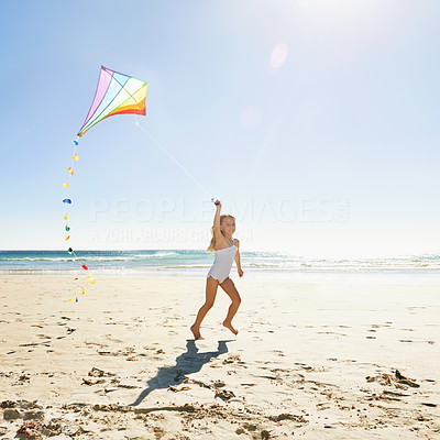 She loves flying a kite on the beach