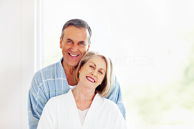 Loving couple - Smiling mature man embracing woman from back