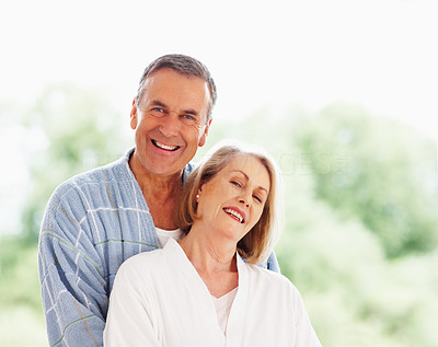Romantic couple - Cheerful mature man embracing woman from back