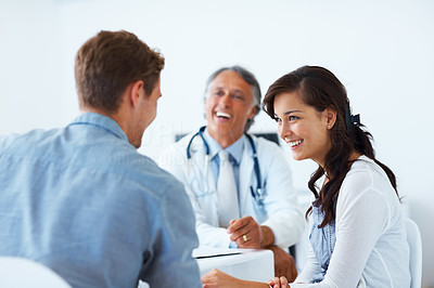 Mature doctor and patients having a healthy conversation