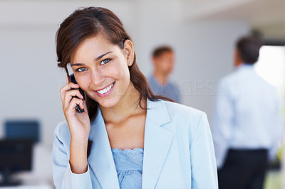 Attractive business woman talking on cellphone
