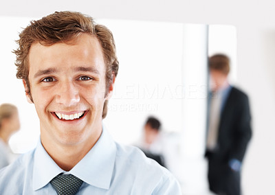 Happy male business executive at office