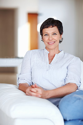 Business woman smiling on sofa