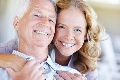 Close-up portrait of a smiling senior couple