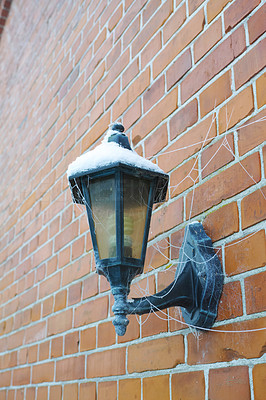 A lamp on the wall in Wintertime