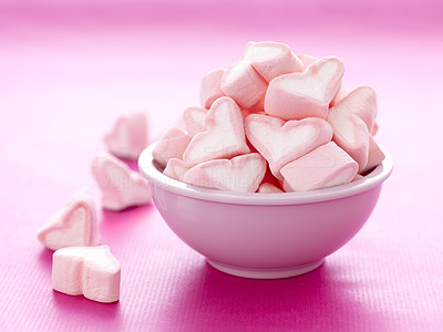 Serving of valentines day snacks on pink background