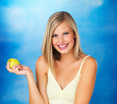 Happy woman holding apple