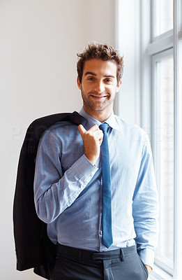 Relaxed executive with jacket over shoulder
