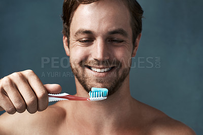 Taking care of his pearly whites