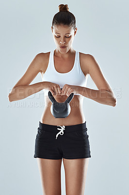 Using a kettle bell to further her progress