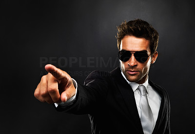 Secret agent pointing at someone