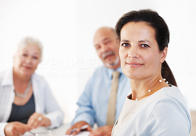 Confident executive with colleagues during meeting
