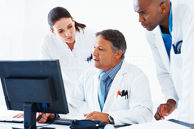 Doctors reviewing medical reports