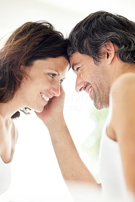 Happy mature couple looking face to face at eachother