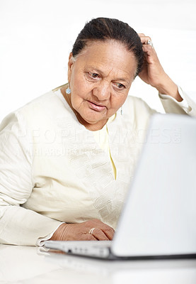 Retired old woman browsing the internet