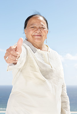 An old lady showing thumbs up sign - Outdoor