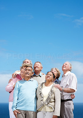 A group of old people looking upwards - Copyspace