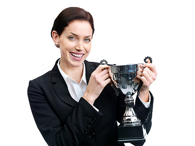Victory - Joyful young female entrepreneur holding a trophy