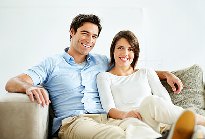 Lovely young couple sitting on the couch