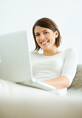 Beautiful young woman working on laptop