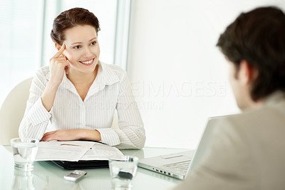 Young business woman interviewing a man for the job