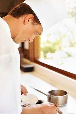 Male cook working in hotel kitchen