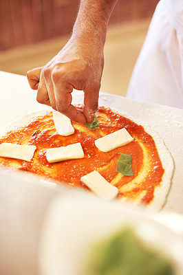 Chef preparing tasty pizza