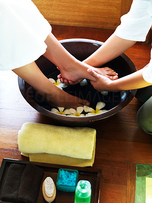 Woman having foot massage by therapist