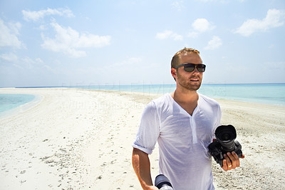 Yuri Arcurs on a deserted Island in the Maldives doing a photo shoot