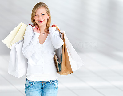 Young girl holding shopping bags