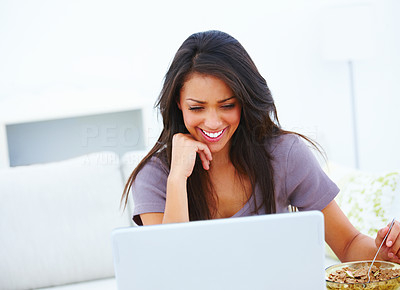 Happy woman sitting with laptop