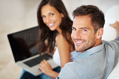 Man with woman working on laptop