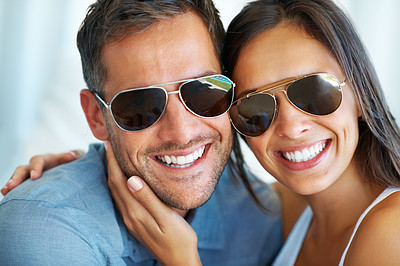 Couple in sunglasses having happy time