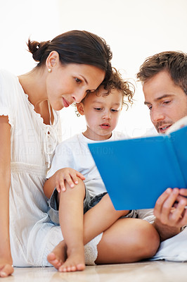 Cute family reading book