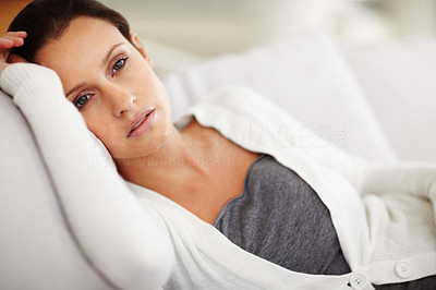 Young relaxed female lying on the couch