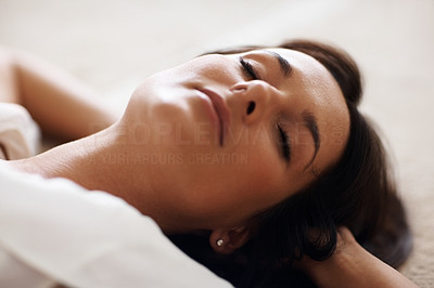Closeup of a pretty woman sleeping on the floor