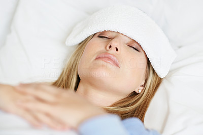Sick attractive young woman asleep in bed