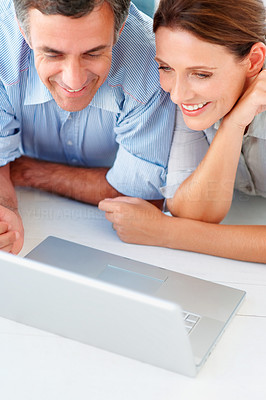 Mid section of an old couple purchasing from the net