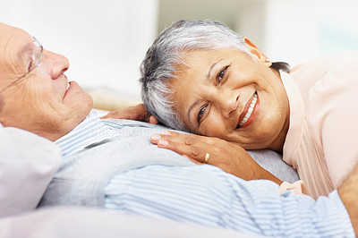 Smiling elderly couple embracing outdoors
