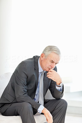 Thoughtful executive thinking about something with copyspace