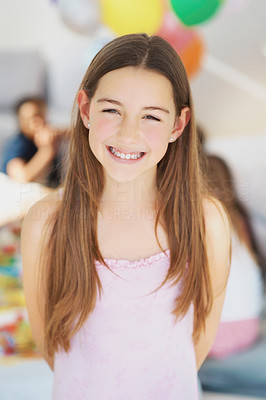 Portrait of a happy little girl at a birthday party