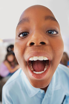 Cute African American boy making a funny face