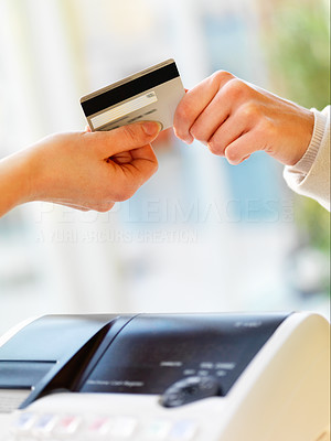 Woman hands of a buyer and seller holding credit card