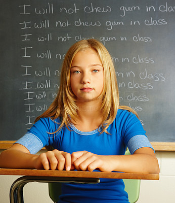 Portrait of schoolgirl punished for chewing gum in classroom