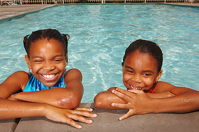 Happy wet African kids by the pool