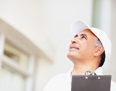 Maintenance guy looking up at copyspace