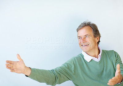 Happy old man with open arms on white background