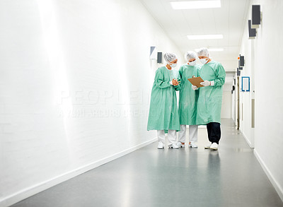 Medical team confering a patient treatment